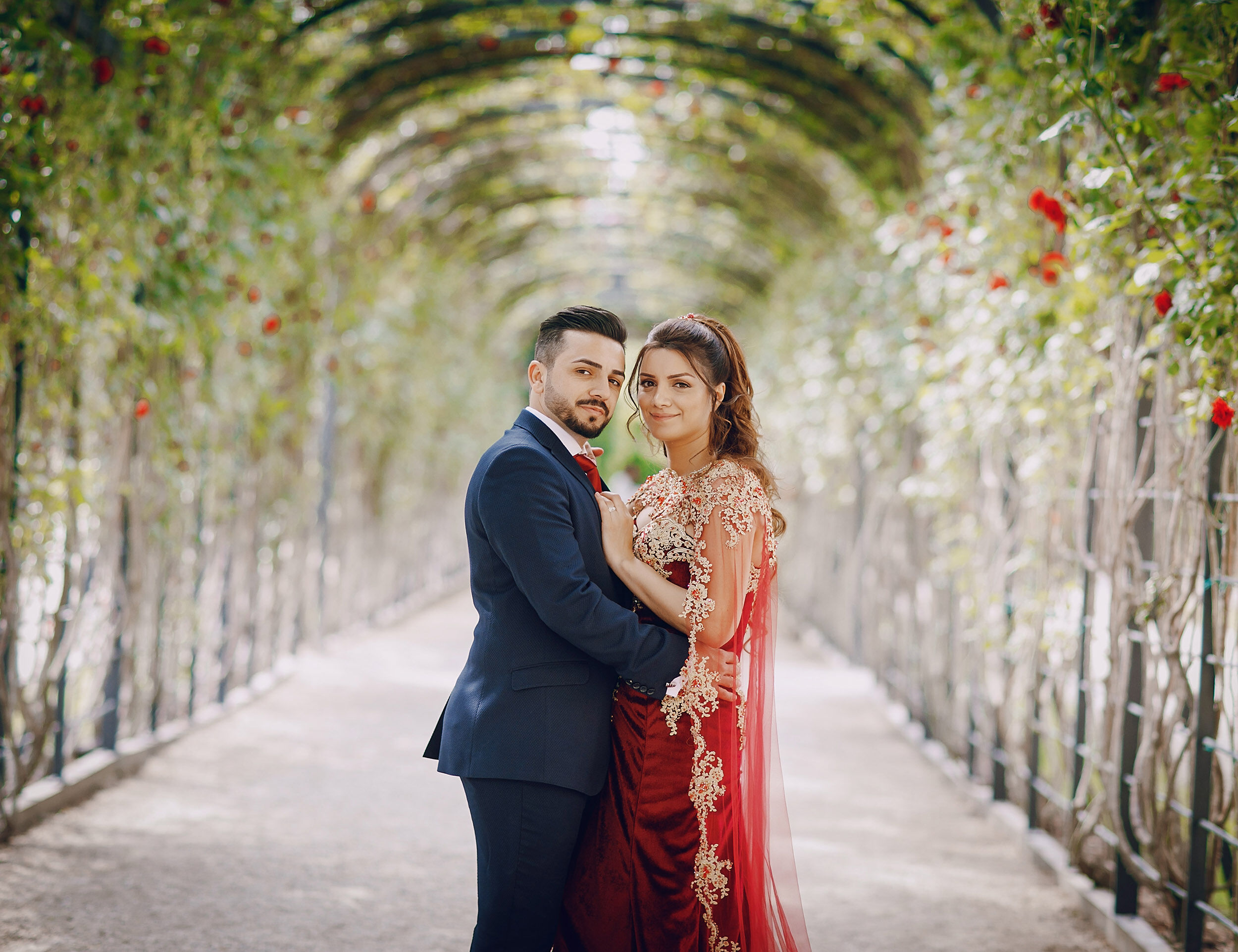 Beautiful Bride and Groom in wedding setup with flowers and stage
